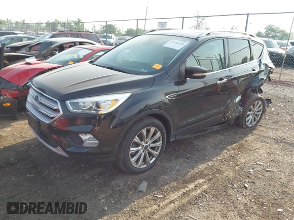 2018 Ford Escape Titanium with VIN 1FMCU9J95JUB30803, listed as a IAAI auction lot 42286536 with 63,309 mi miles and . Bid and sale history available at DreamBid. Image 2.