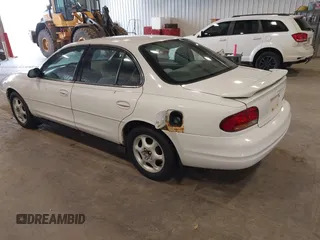 1999 Oldsmobile Intrigue GX z VIN 1G3WH52K6XF328030, wystawiony jako IAAI lot #42334804 z przebiegiem Nie podano mil oraz . Historia ofert i sprzedaży dostępna na DreamBid. Obrazek 3.