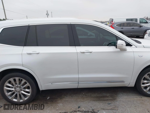 2021 Cadillac XT6 Premium Luxury z VIN 1GYKPCRSXMZ169206, wystawiony jako IAAI lot #41581841 z przebiegiem 64 789 mil mil oraz . Historia ofert i sprzedaży dostępna na DreamBid. Obrazek 13.