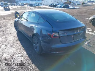 2023 Tesla Model 3 with VIN 5YJ3E1EA7PF509567, listed as a IAAI auction lot 41422396 with 28,914 mi miles. Bid and sale history available at carsss.com. Image 3.