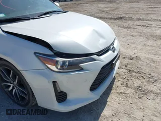 2016 Scion tC with VIN JTKJF5C70GJ019590, listed as a IAAI auction lot 41798426 with 69,045 mi miles. Bid and sale history available at carsss.com. Image 20.