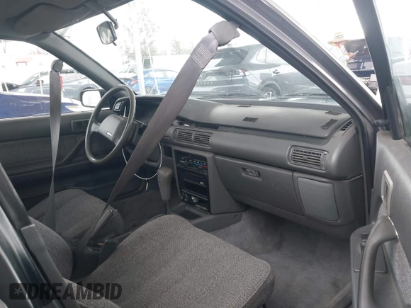 1990 Toyota Camry DLX z VIN 4T1SV21E7LU248206, wystawiony jako IAAI lot #41793635 z przebiegiem 83 550 mil mil oraz . Historia ofert i sprzedaży dostępna na DreamBid. Obrazek 5.