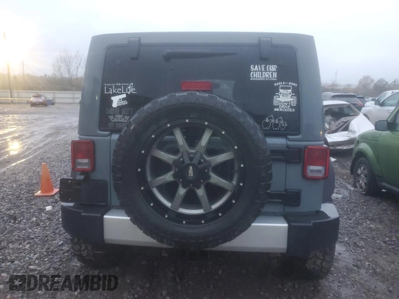 2015 Jeep Wrangler Unlimited Altitude with VIN 1C4BJWEG2FL526510, listed as a Copart auction lot 80788854 with Not provided miles and Salvage title. Bid and sale history available at DreamBid. Image 6.