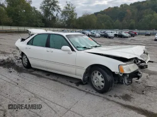 2004 Acura RL w/Navigation System with VIN JH4KA96684C001230, listed as a Copart auction lot 74801074 with 151,266 mi miles and Salvage Title. Bid and sale history available at carsss.com. Image 4.