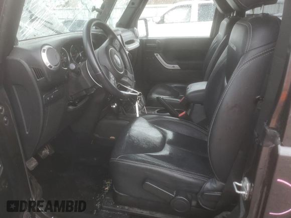 2014 Jeep Wrangler Rubicon with VIN 1C4BJWCG9EL189819, listed as a Copart auction lot 80522204 with 82,083 mi miles and Salvage title. Bid and sale history available at DreamBid. Image 7.