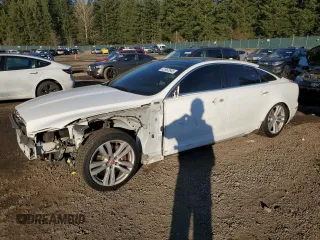 2014 Jaguar XJ Portfolio with VIN SAJWJ2GD2E8V61998, listed as a Copart auction lot 42962645 with 101,609 mi miles and Salvage title. Bid and sale history available at DreamBid. Image 1.