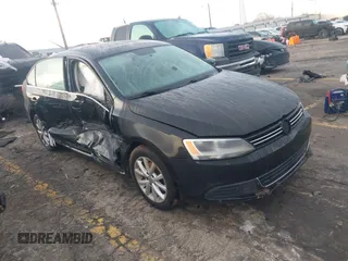 2014 Volkswagen Jetta Sedan SE with VIN 3VWD17AJ1EM322226, listed as a IAAI auction lot 41211984 with 217,084 mi miles. Bid and sale history available at carsss.com. Image 1.