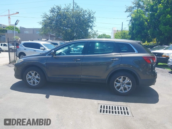 2015 Mazda CX-9 Touring z VIN JM3TB2CV1F0458995, wystawiony jako IAAI lot #42523344 z przebiegiem 130 763 mil mil oraz . Historia ofert i sprzedaży dostępna na DreamBid. Obrazek 14.
