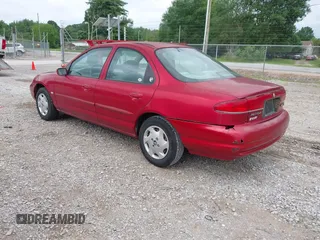 1998 Mercury Mystique z VIN 3MELM6537WM600056, wystawiony jako IAAI lot #42305711 z przebiegiem 206 104 mil mil oraz . Historia ofert i sprzedaży dostępna na DreamBid. Obrazek 3.