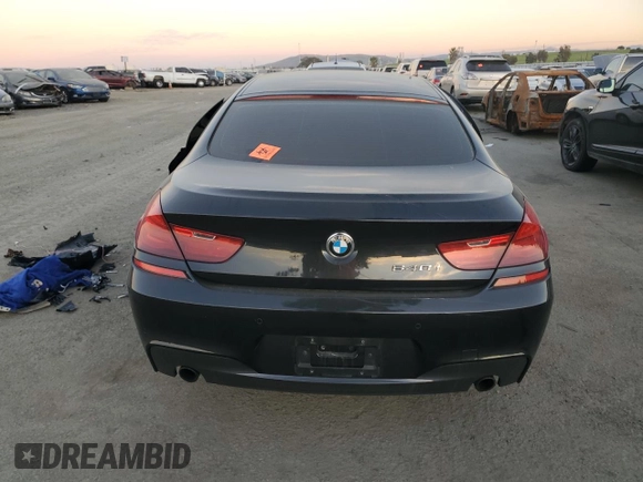 2015 BMW 6 Series 640i z VIN WBA6A0C59FD318390, wystawiony jako Copart lot #87831165 z przebiegiem Nie podano mil oraz Szkoda całkowita • Salvage title. Historia ofert i sprzedaży dostępna na DreamBid. Obrazek 6.