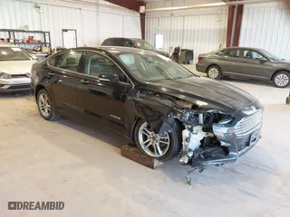 2016 Ford Fusion Titanium Hybrid with VIN 3FA6P0RU7GR127307, listed as a IAAI auction lot 41944427 with 128,076 mi miles. Bid and sale history available at carsss.com. Image 1.