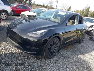 2022 Tesla Model Y Performance with VIN 7SAYGDEF0NF406262, listed as a IAAI auction lot 41132514 with 27,171 mi miles. Bid and sale history available at carsss.com. Image 2.