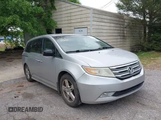 2012 Honda Odyssey Touring with VIN 5FNRL5H95CB101605, listed as a IAAI auction lot 42025163 with 286,421 mi miles. Bid and sale history available at carsss.com. Image 1.