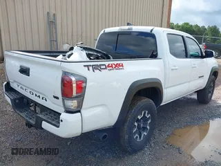 2023 Toyota Tacoma SR with VIN 3TMCZ5AN7PM639378, listed as a IAAI auction lot 42222407 with 38,172 mi miles and . Bid and sale history available at DreamBid. Image 4.