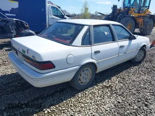 1993 Ford Tempo z VIN 1FAPP36X7PK153107, wystawiony jako IAAI lot #41867198 z przebiegiem 9377 mil mil oraz . Historia ofert i sprzedaży dostępna na DreamBid. Obrazek 4.