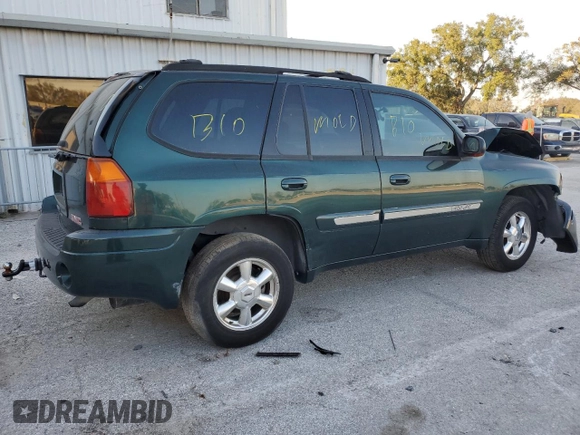 2005 GMC Envoy SLT with VIN 1GKDS13S652329610, listed as a Copart auction lot 76384914 with Not Provided miles and Salvage Title. Bid and sale history available at DreamBid. Image 3.
