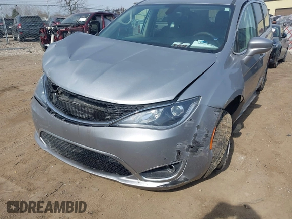 2018 Chrysler Pacifica Touring L with VIN 2C4RC1BG7JR101736, listed as a IAAI auction lot 41776231 with 90,487 mi miles and . Bid and sale history available at DreamBid. Image 6.