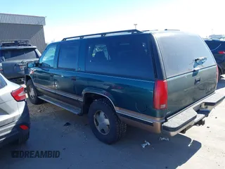 1997 Chevrolet Suburban with VIN 3GNFK16R9VG184722, listed as a IAAI auction lot 41662635 with 176,652 mi miles. Bid and sale history available at carsss.com. Image 3.