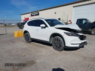 2018 Mazda CX-5 Grand Touring with VIN JM3KFADM0J0377026, listed as a IAAI auction lot 41649686 with 100,901 mi miles and . Bid and sale history available at DreamBid. Image 1.