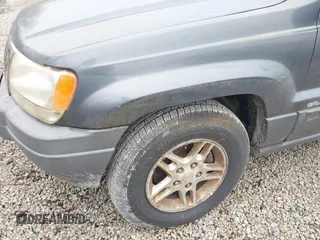 2003 Jeep Grand Cherokee Laredo with VIN 1J4GX48SX3C604904, listed as a IAAI auction lot 40884443 with 188,352 mi miles. Bid and sale history available at carsss.com. Image 6.