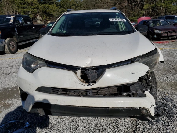 2016 Toyota RAV4 LE with VIN JTMZFREV2GJ077312, listed as a Copart auction lot 88358125 with 126,428 mi miles and Salvage Title. Bid and sale history available at carsss.com. Image 5.