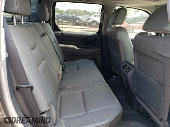 2012 Honda Ridgeline RTL z VIN 5FPYK1F59CB001005, wystawiony jako Copart lot #59713305 z przebiegiem 204 963 mil mil oraz Szkoda całkowita • Salvage title. Historia ofert i sprzedaży dostępna na DreamBid. Obrazek 10.