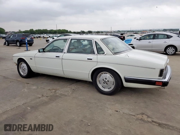 1994 Jaguar XJ with VIN SAJKX1743RC698636, listed as a Copart auction lot 56376685 with 192,928 mi miles and Salvage title. Bid and sale history available at DreamBid. Image 2.