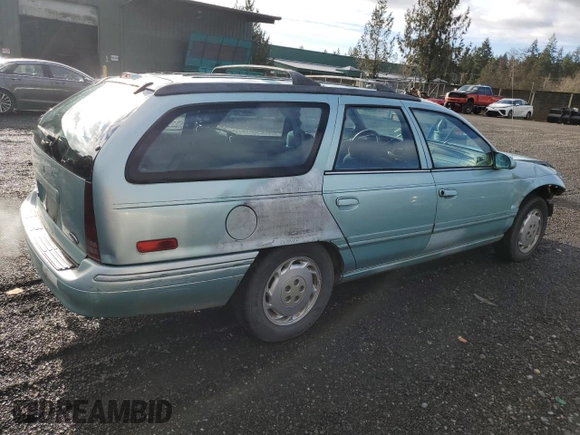 1994 Ford Taurus with VIN 1FALP5747RG236623, listed as a Copart auction lot 85242504 with 205,550 mi miles and Salvage title. Bid and sale history available at DreamBid. Image 3.