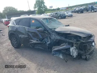 2018 Mazda CX-5 Grand Touring z VIN JM3KFADM5J1365772, wystawiony jako IAAI lot #42251805 z przebiegiem 44 599 mil mil oraz . Historia ofert i sprzedaży dostępna na DreamBid. Obrazek 12.