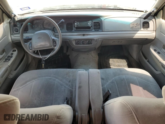 1999 Ford Crown Victoria Police z VIN 2FAFP71WXXX198735, wystawiony jako Copart lot #70526134 z przebiegiem 116 889 mil mil oraz Tytuł czysty. Historia ofert i sprzedaży dostępna na DreamBid. Obrazek 8.