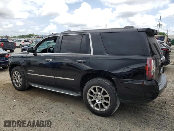 2015 GMC Yukon Denali with VIN 1GKS1CKJ0FR140877, listed as a Copart auction lot 50917985 with 180,726 mi miles and Salvage Title. Bid and sale history available at carsss.com. Image 2.