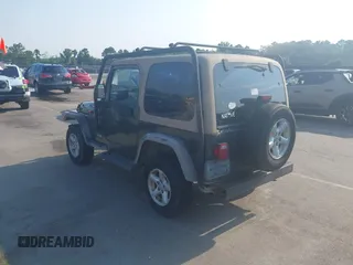 2002 Jeep Wrangler X with VIN 1J4FA39S72P733034, listed as a IAAI auction lot 42659447 with 200,786 mi miles and . Bid and sale history available at DreamBid. Image 3.