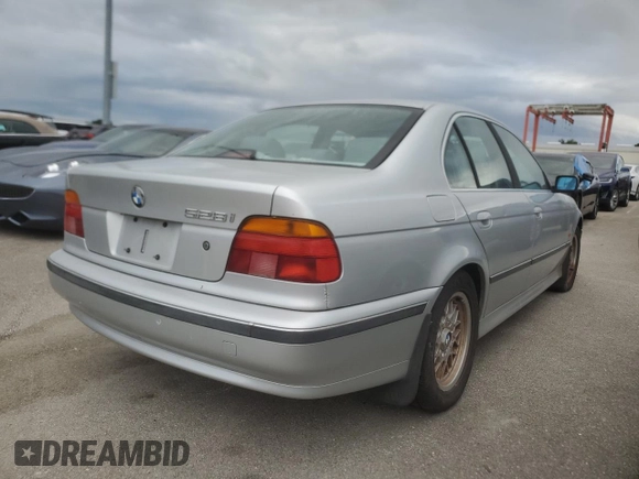 1999 BMW 5 Series 528iA with VIN WBADM6332XBY30585, listed as a Copart auction lot 74830704 with 0 mi miles and Salvage Title. Bid and sale history available at carsss.com. Image 3.