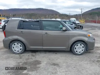 2014 Scion xB with VIN JTLZE4FE9EJ050596, listed as a IAAI auction lot 41884572 with 141,896 mi miles. Bid and sale history available at carsss.com. Image 13.