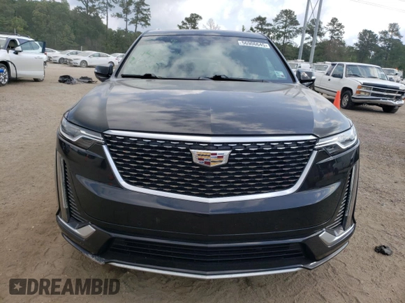 2020 Cadillac XT6 FWD Premium Luxury with VIN 1GYKPCRS6LZ102682, listed as a Copart auction lot 56906645 with 76,884 mi miles and Salvage title. Bid and sale history available at DreamBid. Image 5.