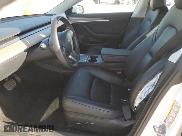 2023 Tesla Model 3 with VIN 5YJ3E1EA4PF631304, listed as a Copart auction lot 52500695 with 33,024 mi miles and Salvage title. Bid and sale history available at DreamBid. Image 7.