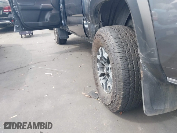 2023 Toyota Tacoma SR with VIN 3TMCZ5AN0PM635933, listed as a IAAI auction lot 42543126 with 32,960 mi miles and . Bid and sale history available at DreamBid. Image 20.