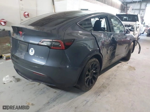 2023 Tesla Model Y Long Range with VIN 7SAYGDEE3PA034830, listed as a IAAI auction lot 41351397 with 26,704 mi miles. Bid and sale history available at carsss.com. Image 4.