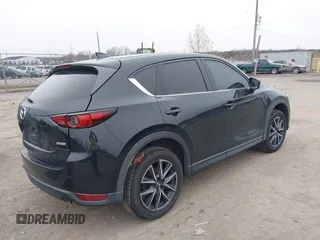 2017 Mazda CX-5 Grand Touring with VIN JM3KFBDL6H0179557, listed as a IAAI auction lot 41546493 with 103,585 mi miles. Bid and sale history available at carsss.com. Image 4.