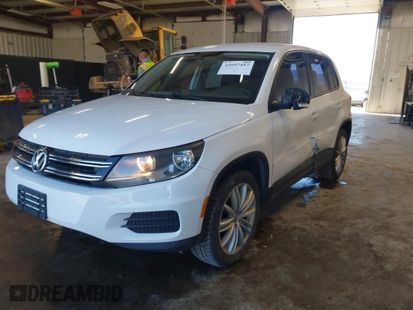 2013 Volkswagen Tiguan with VIN WVGCV3AX7DW605594, listed as a IAAI auction lot 42057457 with 131,629 mi miles and . Bid and sale history available at DreamBid. Image 17.