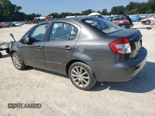 2011 Suzuki SX4 LE with VIN JS2YC5A27B6304410, listed as a Copart auction lot 72119824 with 118,357 mi miles and Salvage Title. Bid and sale history available at carsss.com. Image 2.