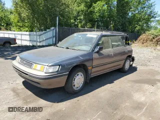 1993 Subaru Legacy L with VIN 4S3BJ6339P6948161, listed as a Copart auction lot 63123584 with 329,619 mi miles and Salvage Title. Bid and sale history available at DreamBid. Image 1.