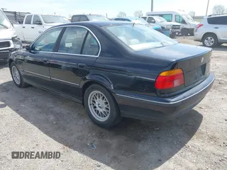 1999 BMW 5 Series 528iA with VIN WBADM6331XBY29010, listed as a IAAI auction lot 42103420 with 196,575 mi miles. Bid and sale history available at carsss.com. Image 3.