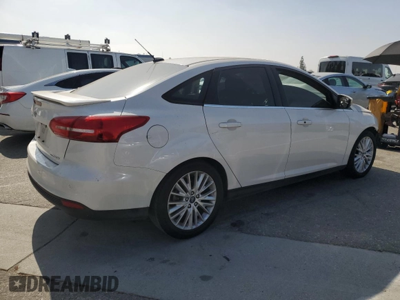 2017 Ford Focus Titanium with VIN 1FADP3J2XHL291606, listed as a Copart auction lot 58268285 with 153,272 mi miles and Salvage title. Bid and sale history available at DreamBid. Image 3.