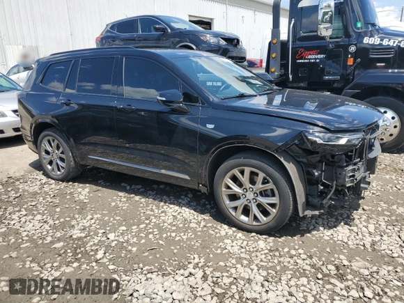2020 Cadillac XT6 AWD Sport with VIN 1GYKPGRS2LZ121673, listed as a Copart auction lot 60315414 with 34,430 mi miles and Salvage title. Bid and sale history available at DreamBid. Image 4.