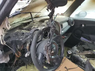 2011 MINI Hardtop z VIN WMWSU3C50BT182884, wystawiony jako Copart lot #56291255 z przebiegiem Nie podano mil oraz Szkoda całkowita • Salvage title. Historia ofert i sprzedaży dostępna na DreamBid. Obrazek 9.