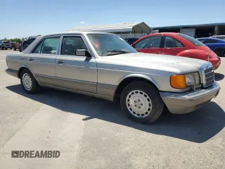 1990 Mercedes-Benz 300 with VIN WDBCA24D1LA529716, listed as a Copart auction lot 56581335 with 122,286 mi miles and Salvage Title. Bid and sale history available at DreamBid. Image 4.