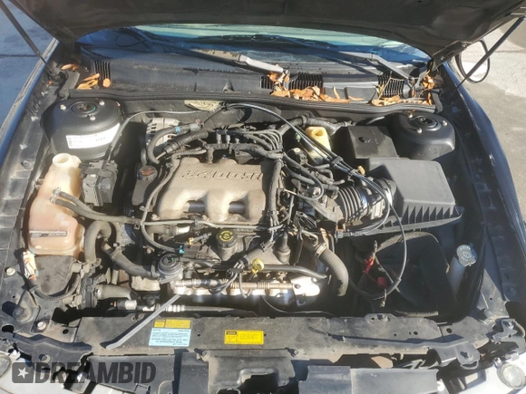 2000 Oldsmobile Alero GLS z VIN 1G3NF52E5YC322556, wystawiony jako Copart lot #85916554 z przebiegiem 169 600 mil mil oraz Szkoda całkowita • Salvage title. Historia ofert i sprzedaży dostępna na DreamBid. Obrazek 13.