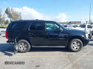 2009 Chevrolet Tahoe 2LT z VIN 1GNFC23059R186790, wystawiony jako IAAI lot #41929109 z przebiegiem 263 596 mil mil oraz . Historia ofert i sprzedaży dostępna na DreamBid. Obrazek 13.