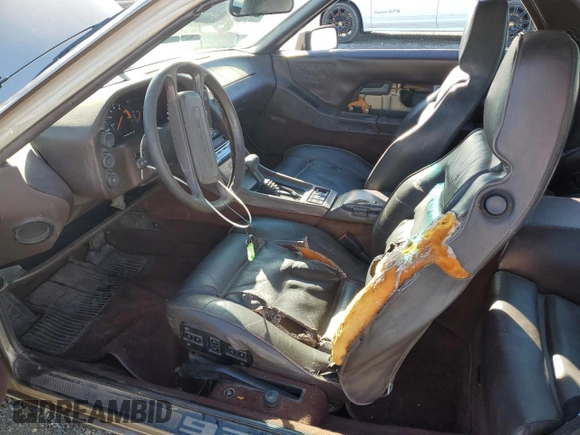 1984 Porsche 928 z VIN WP0JB0920ES860222, wystawiony jako Copart lot #44055645 z przebiegiem 166 689 mil mil oraz Nie do naprawy. Historia ofert i sprzedaży dostępna na DreamBid. Obrazek 7.